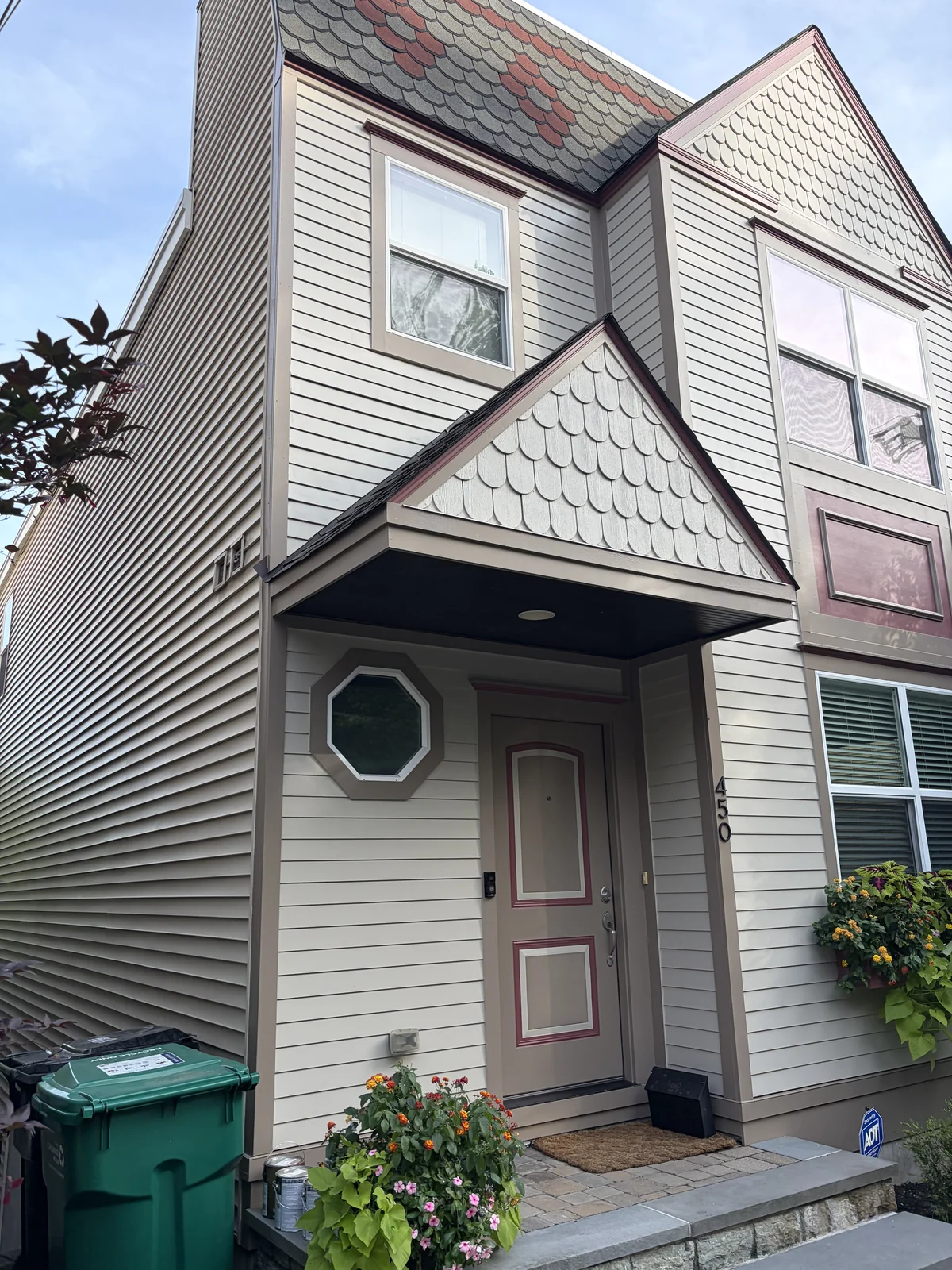 Finished exterior house painting with clean lines, refreshed siding, trim, and roofline completed by Quality Painters