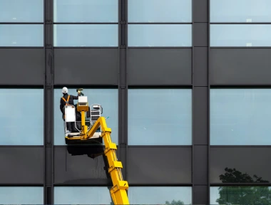Facade cleaning and signage maintenance crew