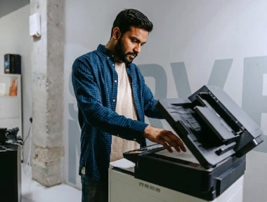 Photostat copy machine in use