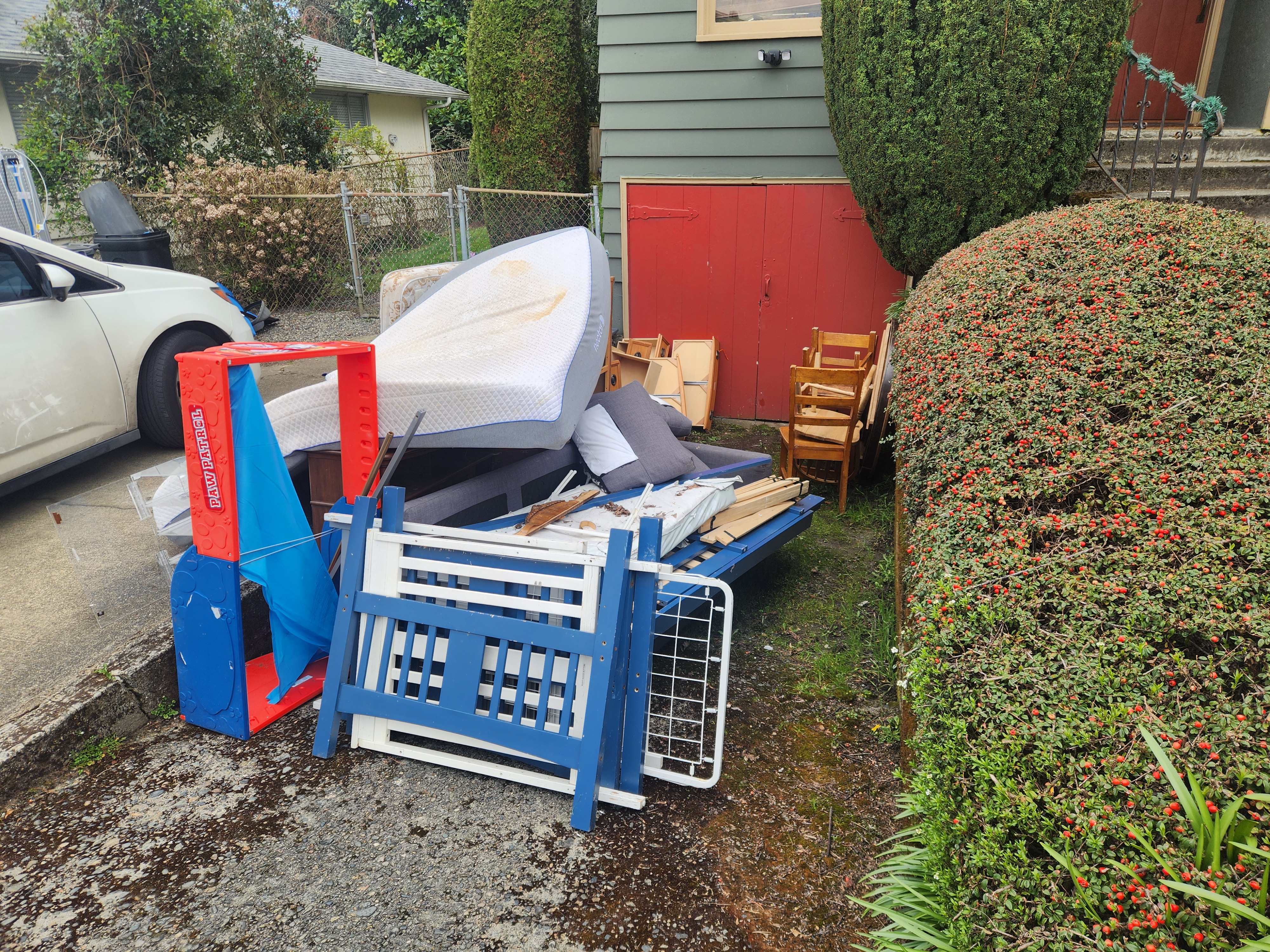 Renton Driveway Cleanup - Cluttered space before junk removal