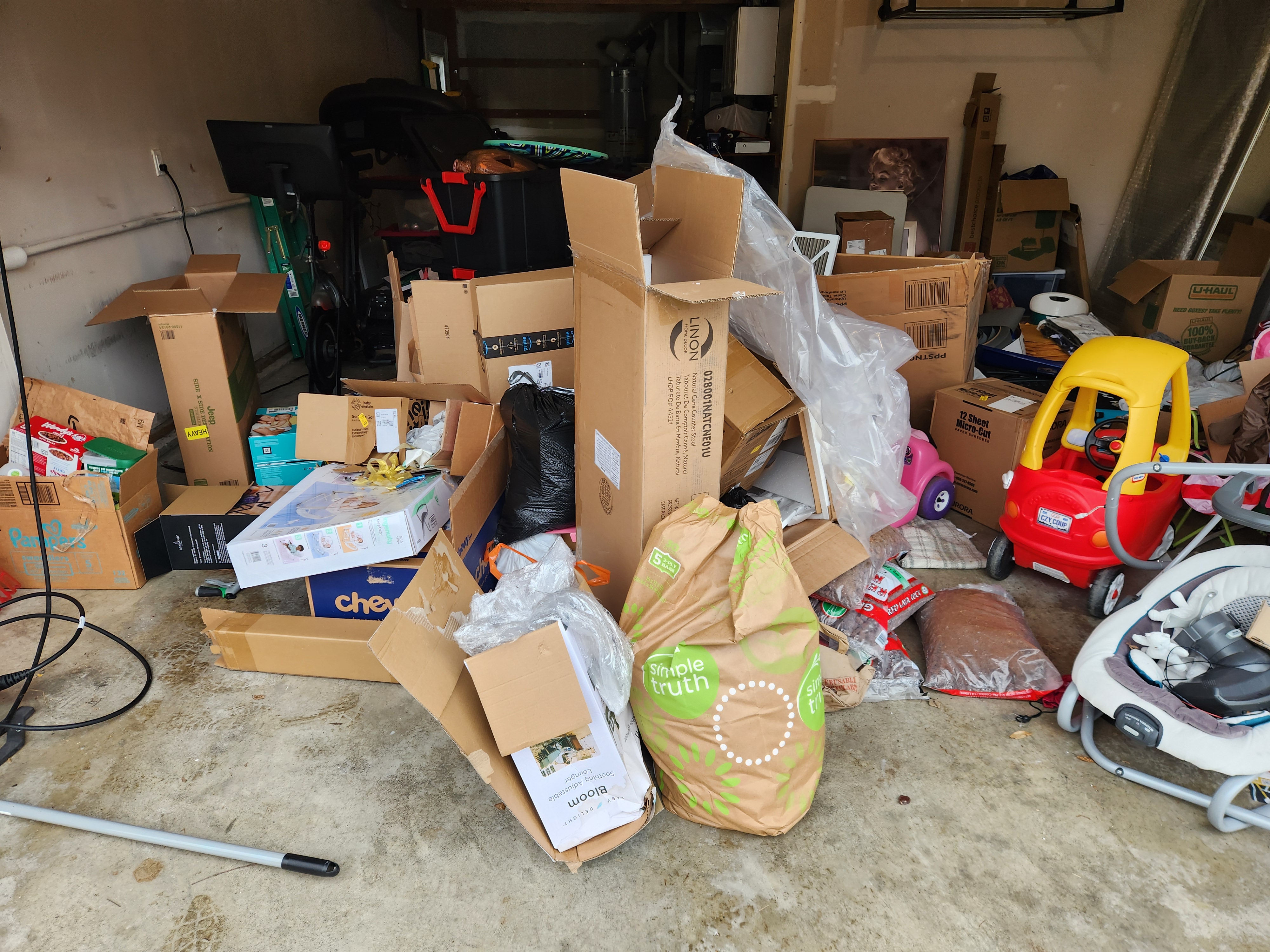 Renton Garage Transformation - Cluttered space before junk removal