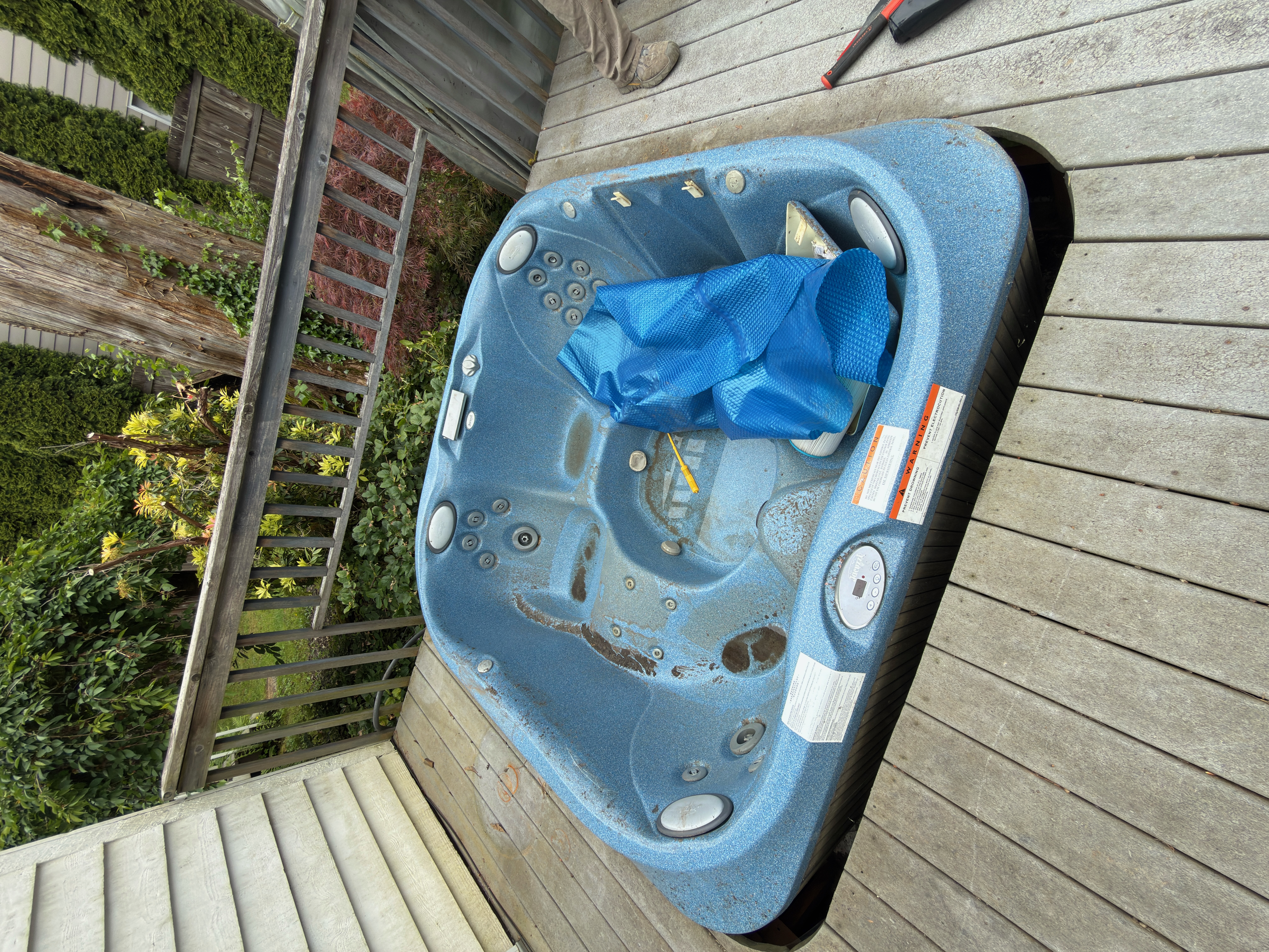 Renton Hot Tub Demolition - Cluttered space before junk removal