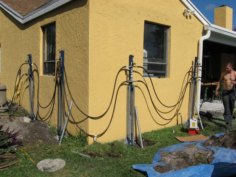 SCFS crew member beside piers installed along a home's foundation corner