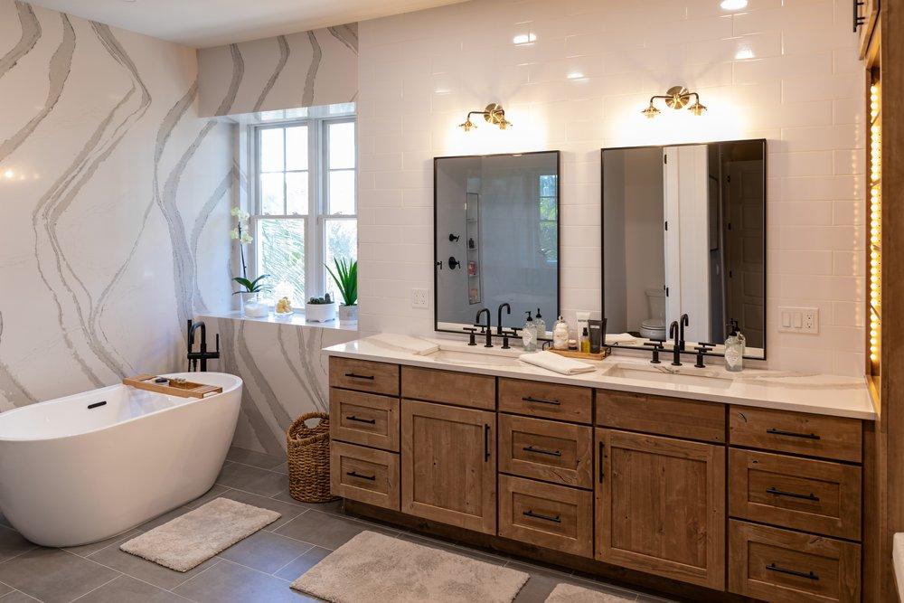 Bathroom with a full stone wall