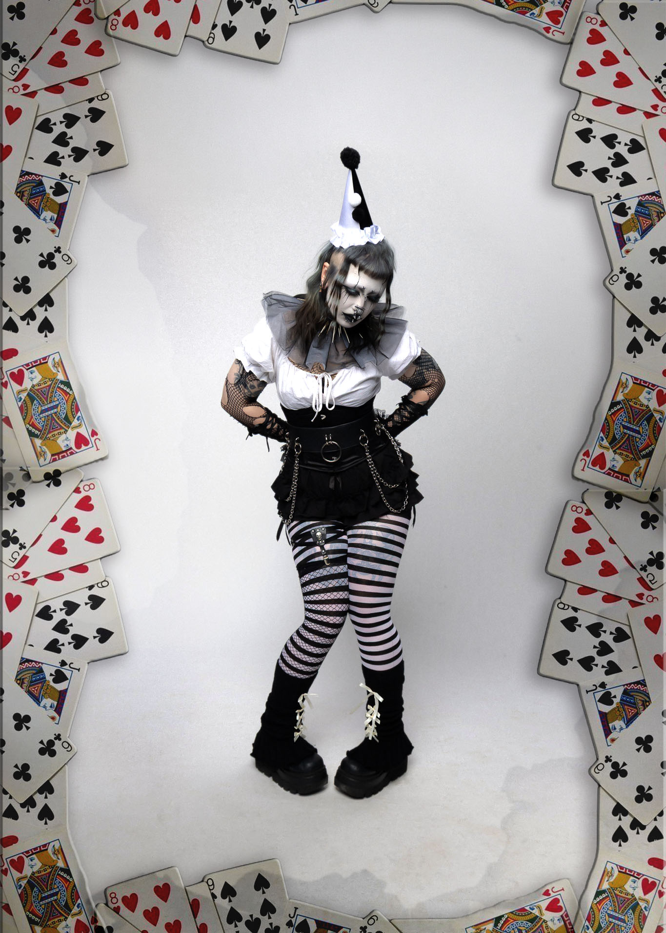 Black and white portrait of a woman in gothic circus styling