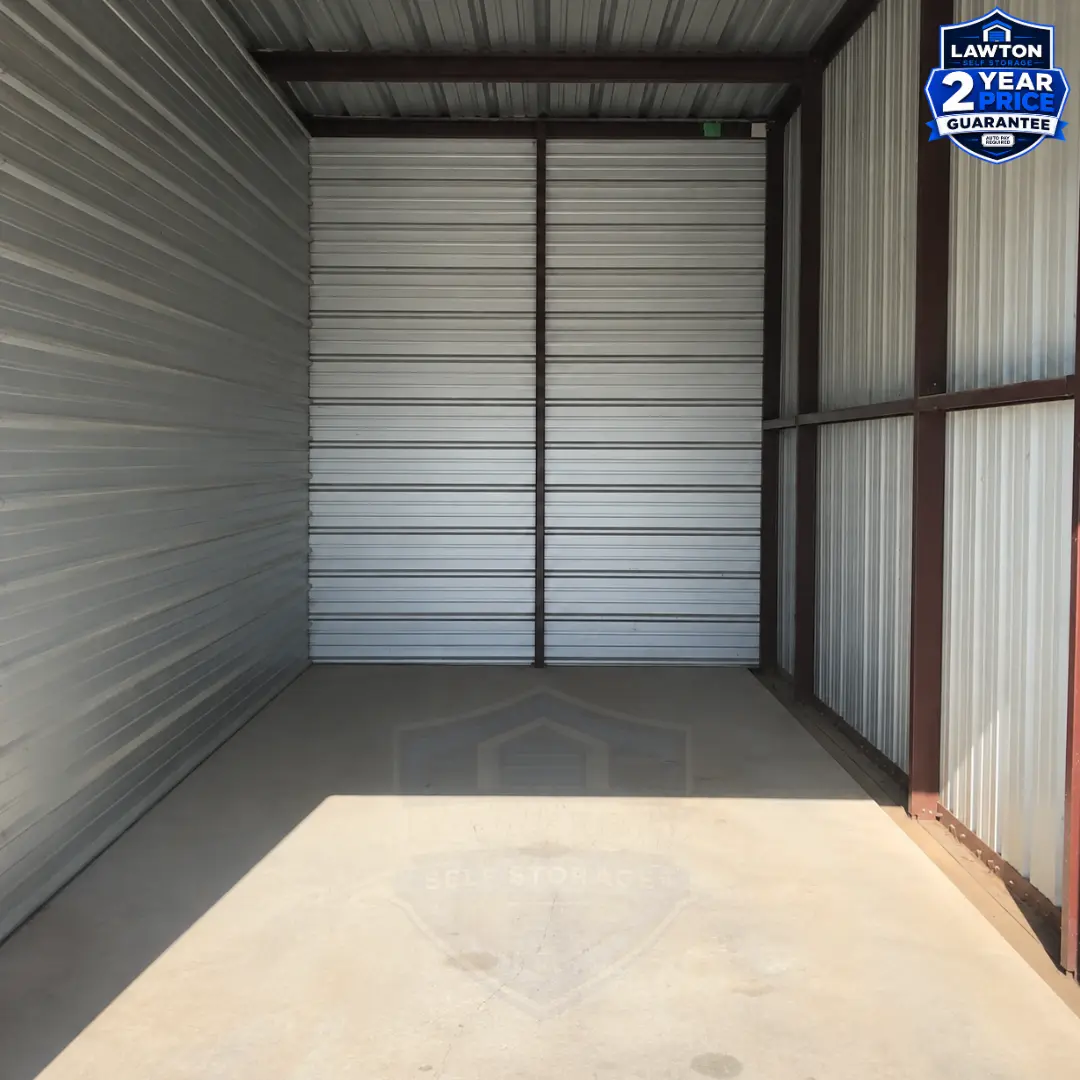 Inside an empty 10 by 15 drive-up storage unit at Lawton Self Storage, showing the full depth of the unit