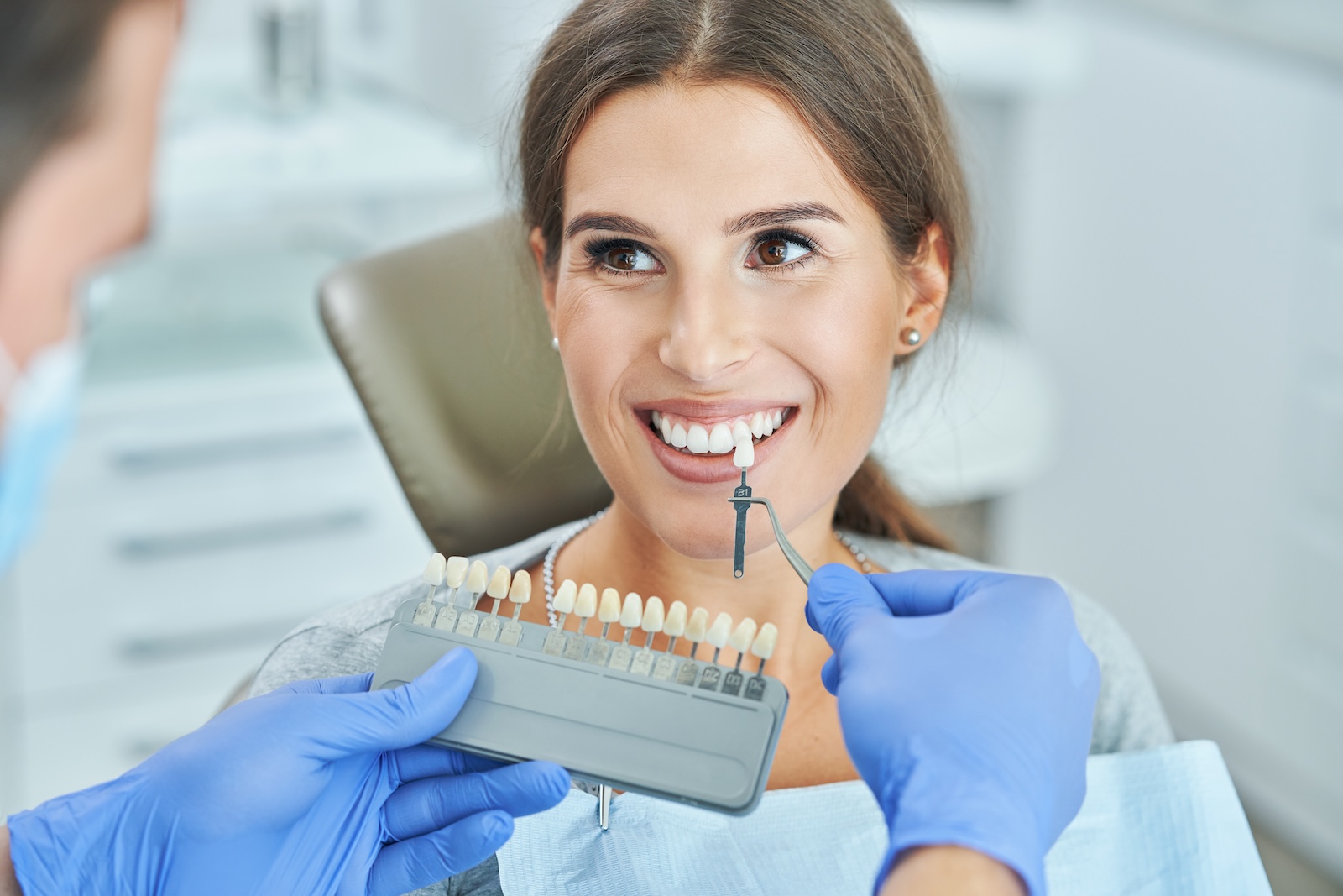 Woman with a flawless smile after dental veneers at Impact Dental Liverpool