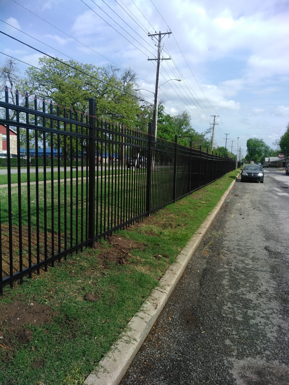 A sturdy and elegant wood fence installed by Viper Fence LLC in a residential backyard