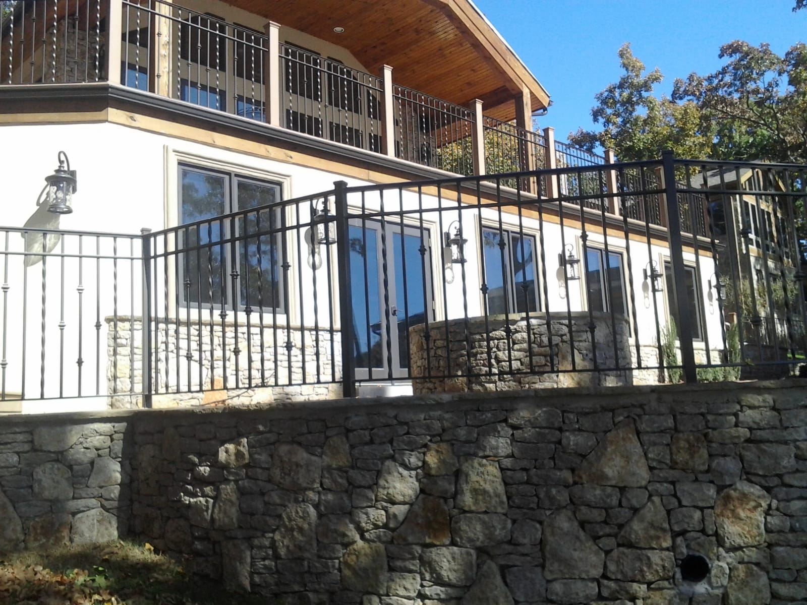 A newly installed wood privacy fence with a gate in a residential area