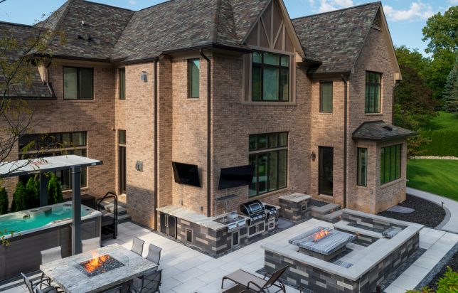 Custom paver patio installation at Hinsdale brick home