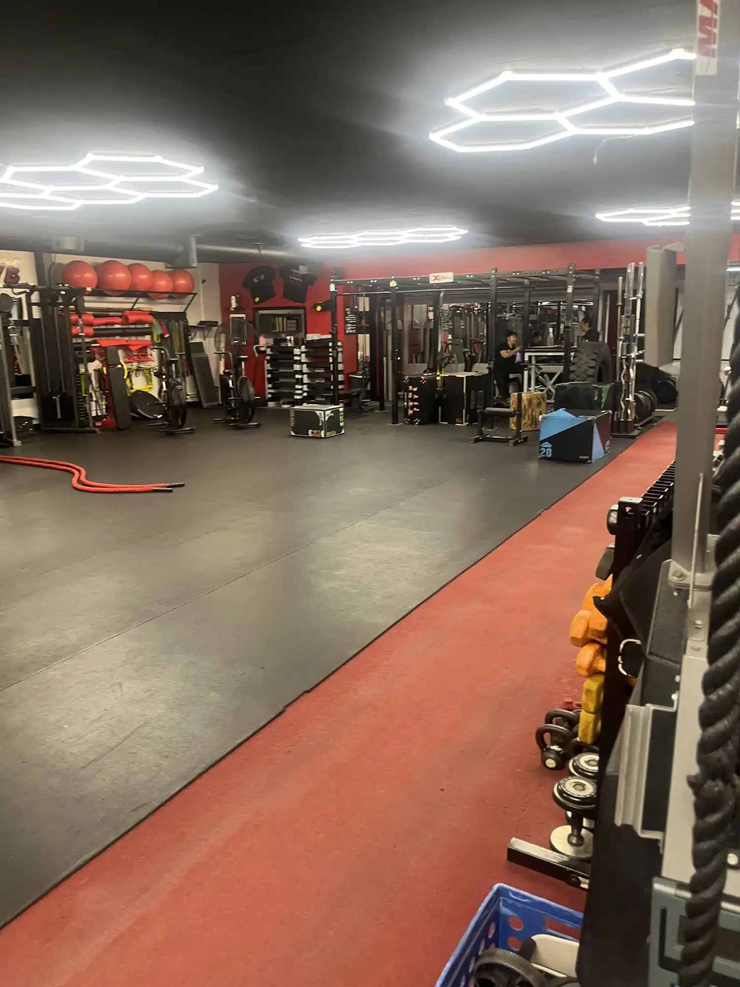Xcel Fitness gym interior in Whittier with training equipment and LED lights