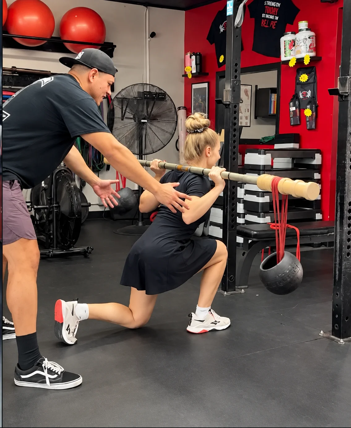 Personal trainer working one on one with member at Xcel Fitness
