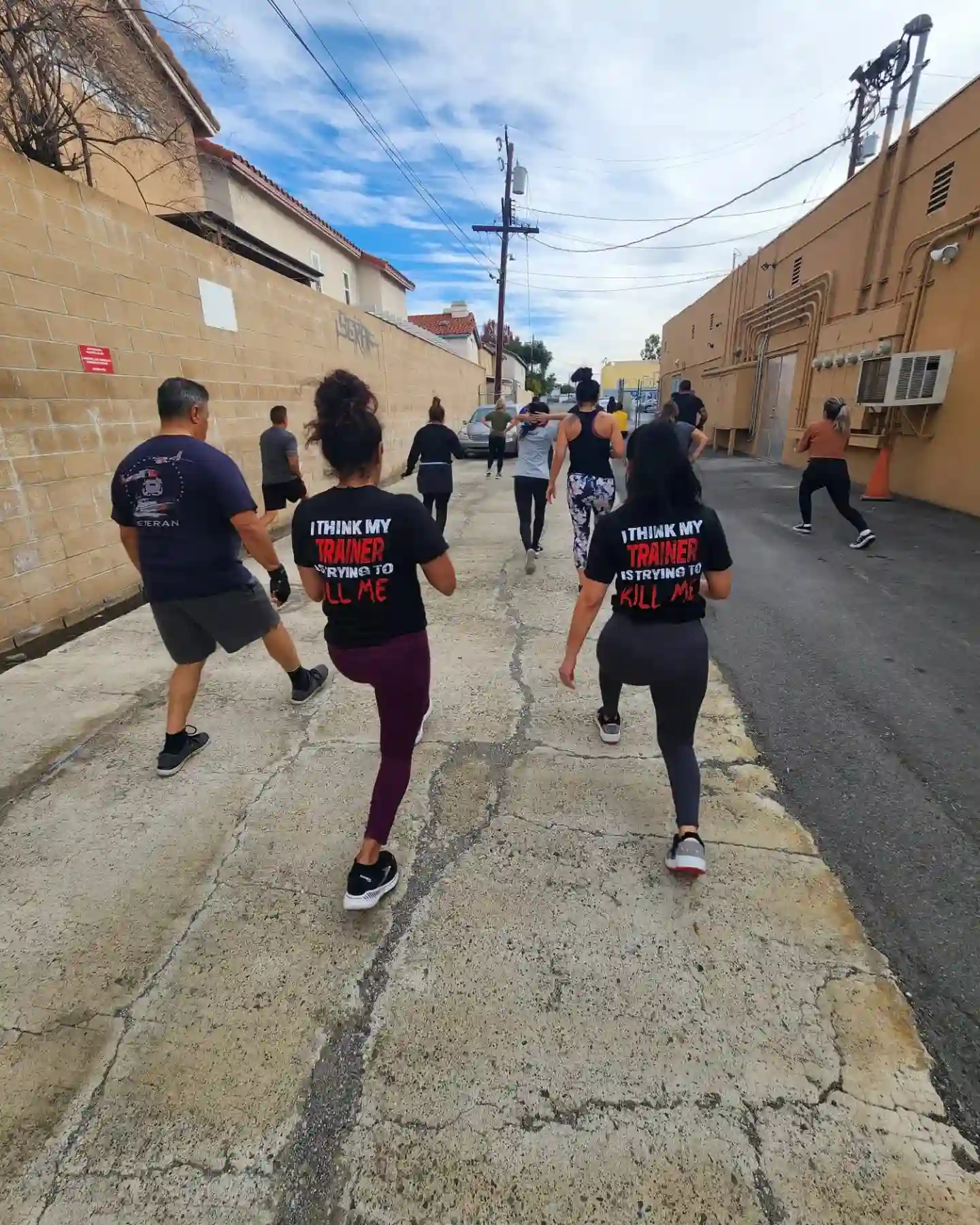 Outdoor group fitness session with Xcel Fitness members
