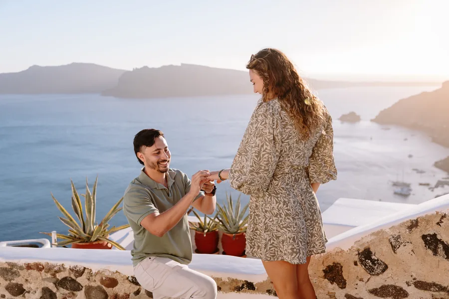 Ricardo slides the ring onto Elise’s finger at the terrace wall