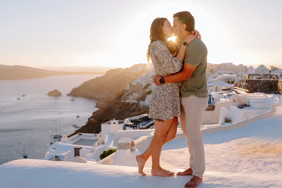 The kiss on the dome at sunset, the sun flaring between them: the photo on the front page