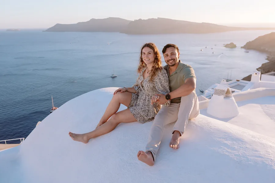 Sitting together on the dome, the caldera wide behind them