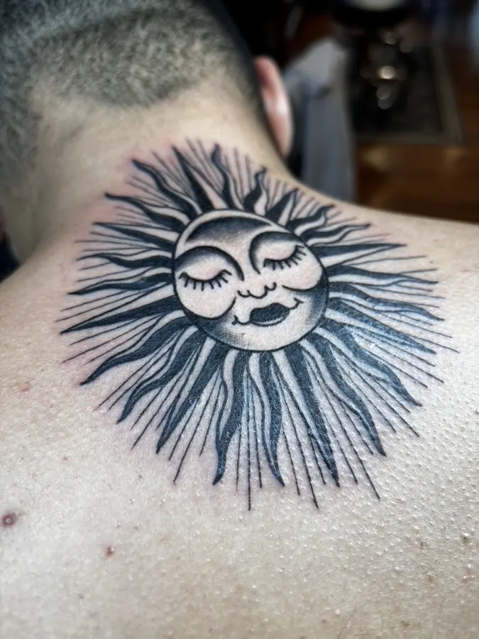 Sun tattoo on the back of the neck by Orne