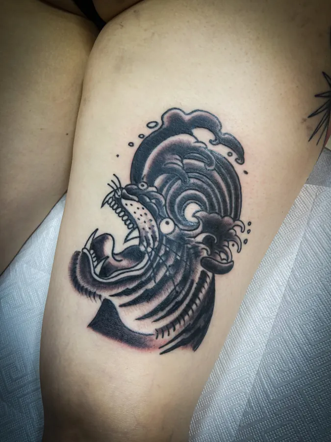 Panther head with waves tattoo by Orne