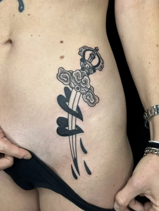 Traditional dagger tattoo by Orne