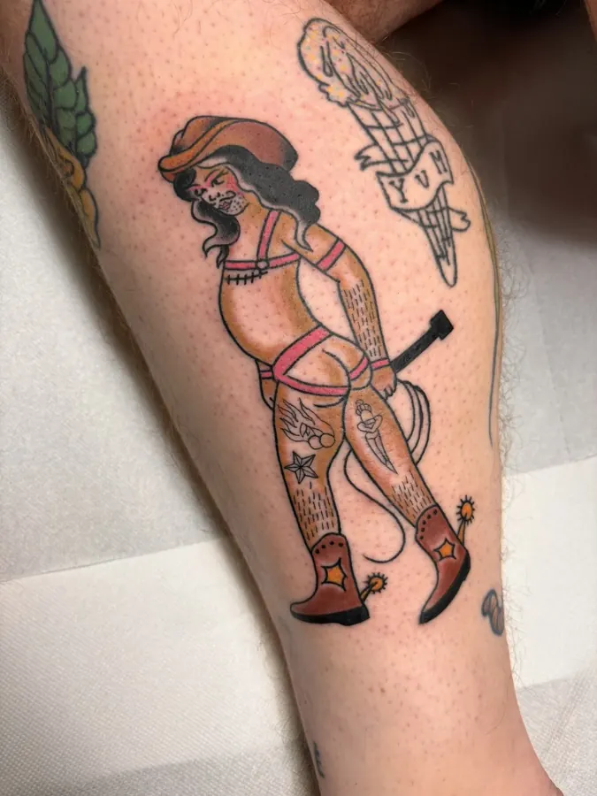 Traditional cowgirl pin-up tattoo by Orne