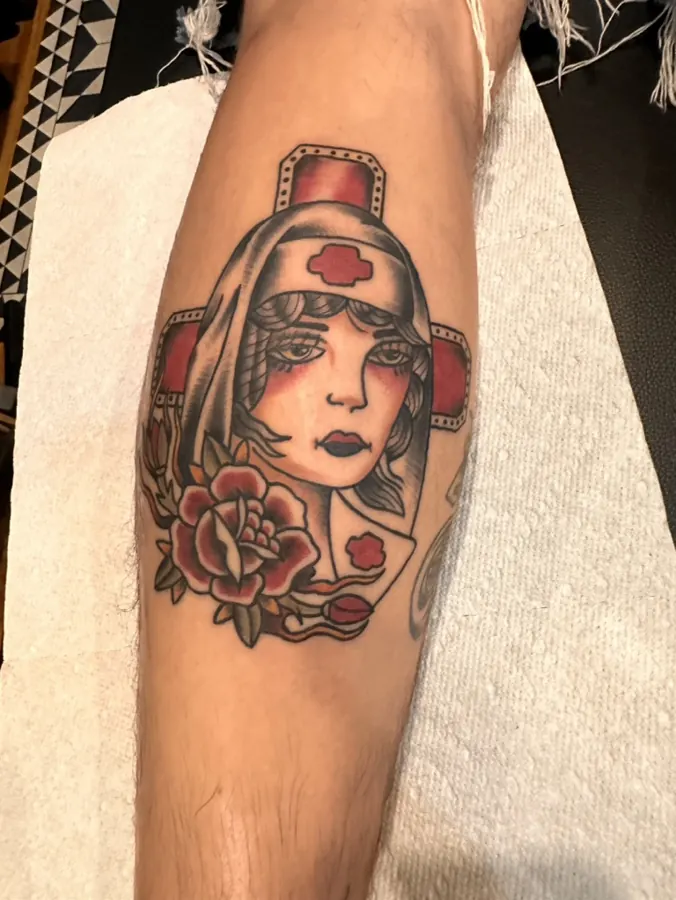 American traditional nurse with rose tattoo by Orne