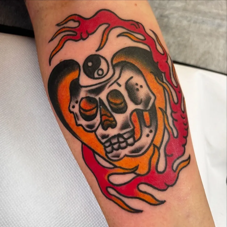 Colour skull in flames tattoo by Orne