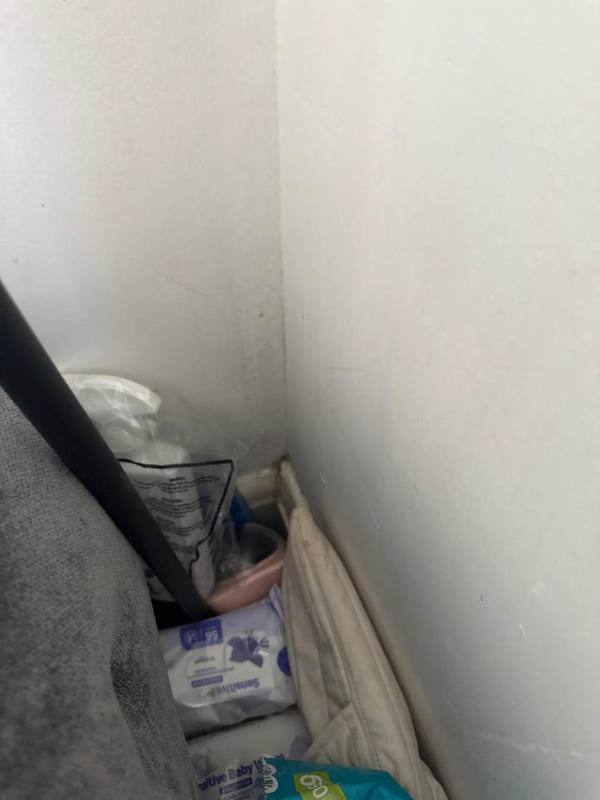 Cluttered hallway before the void works