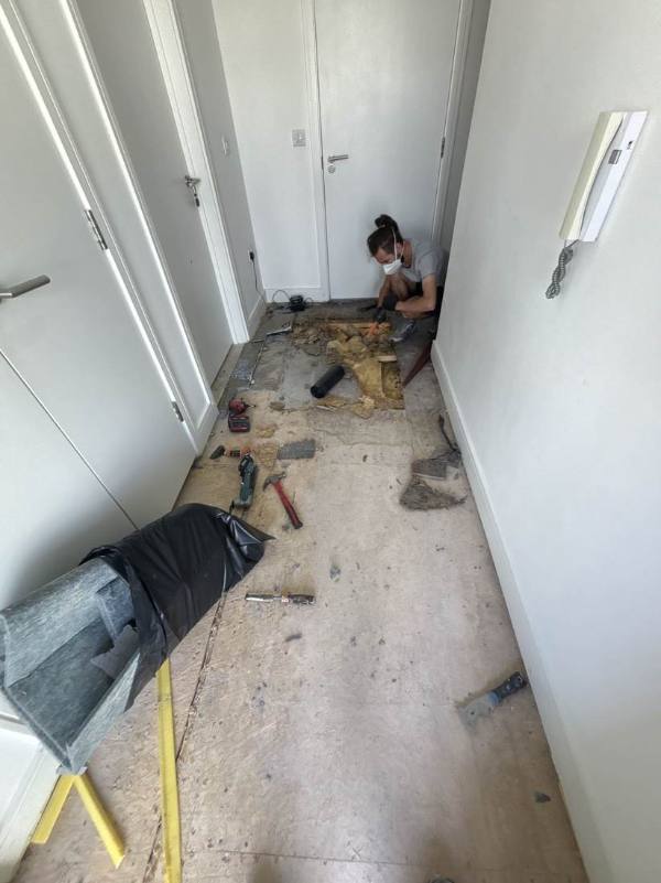 Void hallway with old flooring stripped out