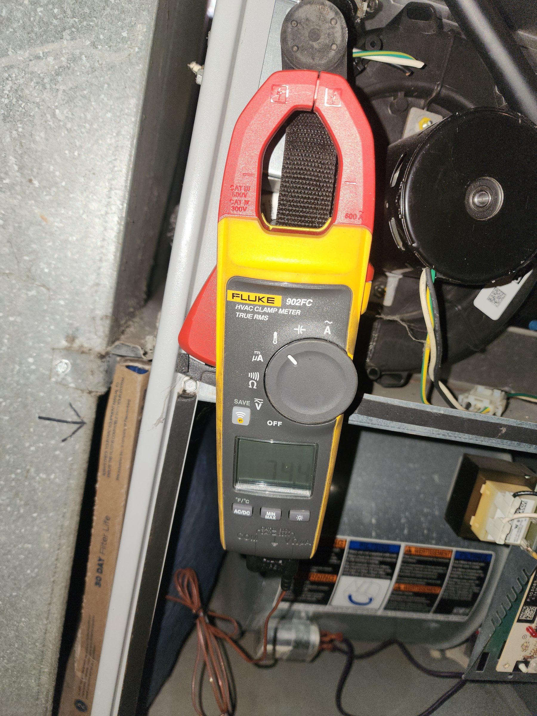 True RMS clamp meter on a blower compartment
