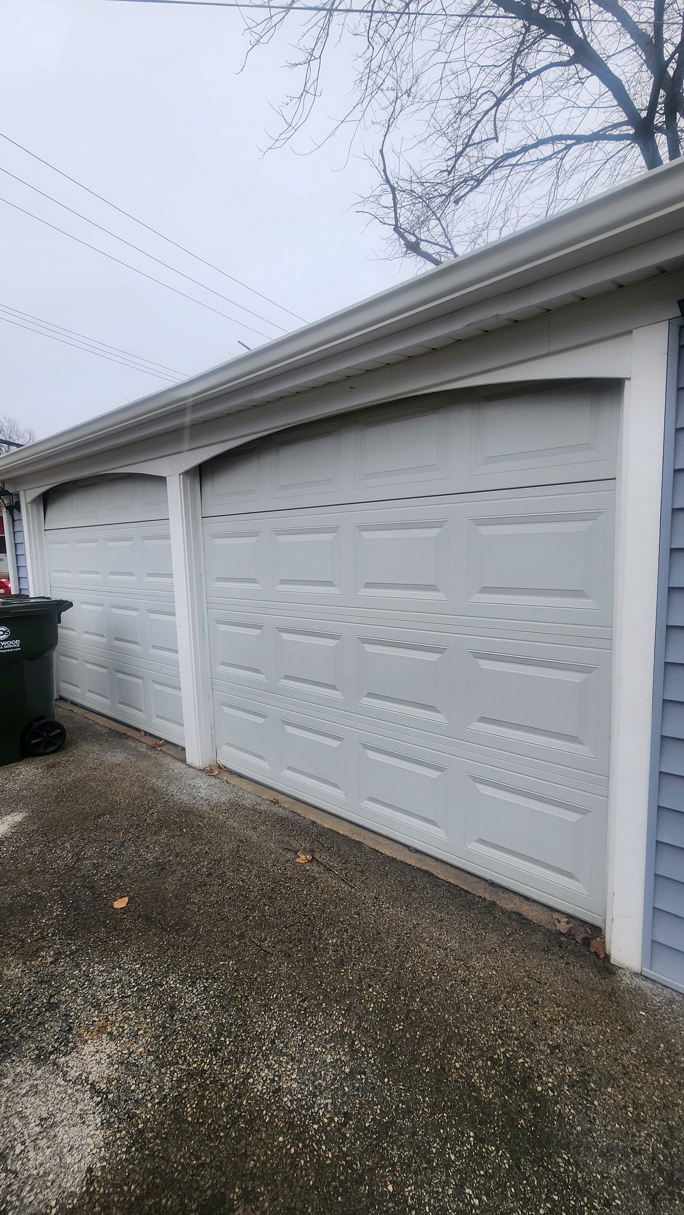 Pair of grey raised-panel garage doors
