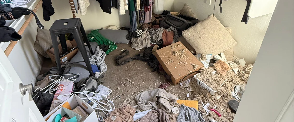 Messy closet before water damage restoration