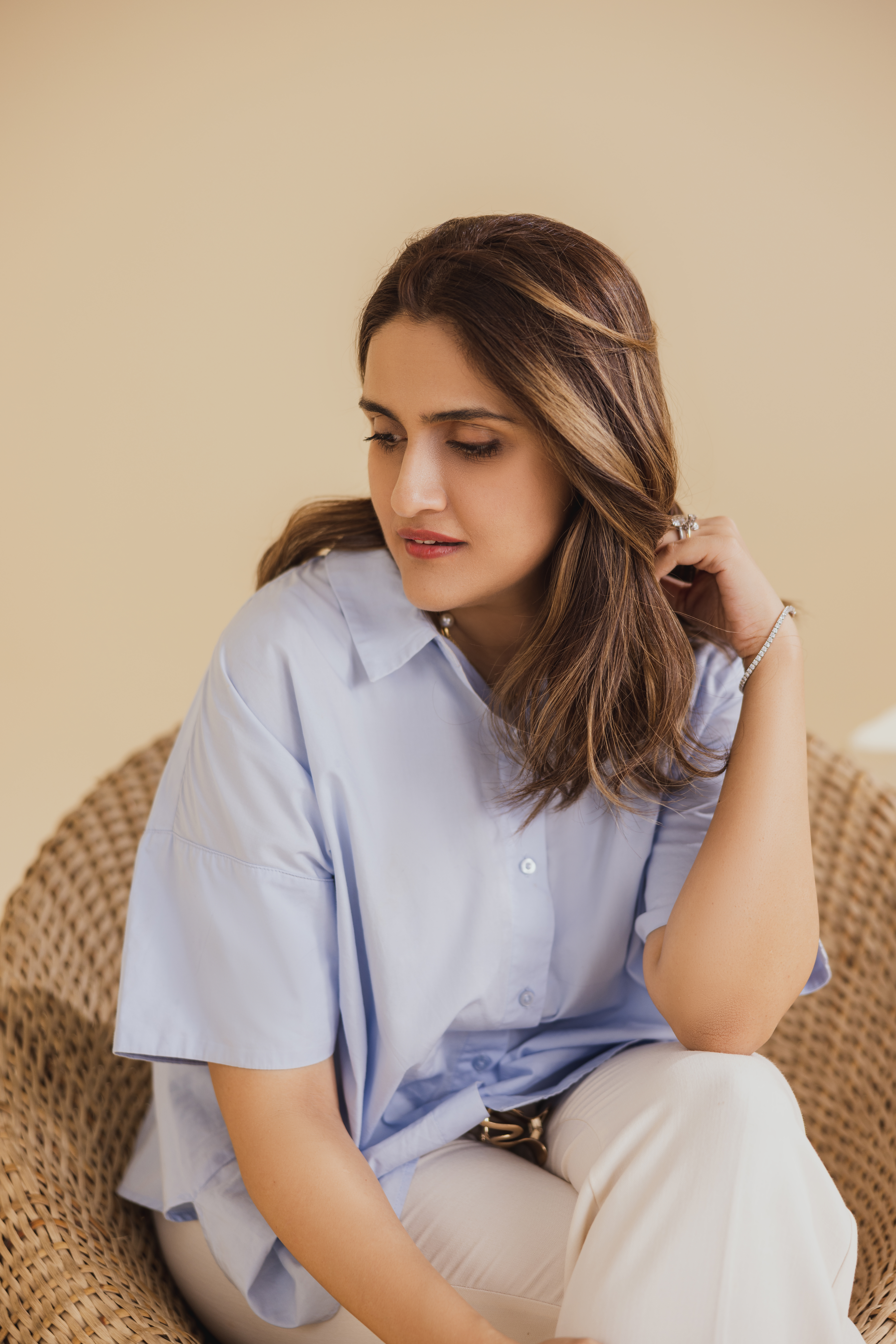 Hania Saleem, designer of KORA, in an embellished olive cape gown
