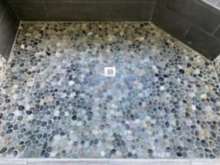 Pebble shower floor with square drain