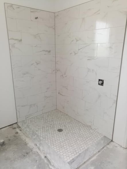 Marble shower with hex floor