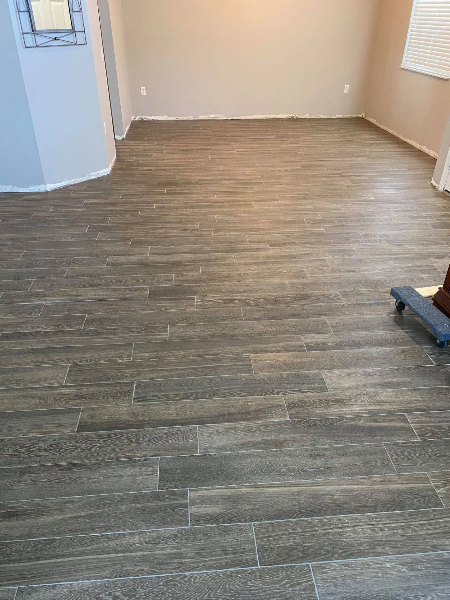 Wood-look flooring in a living area from our Lakeland-area jobs