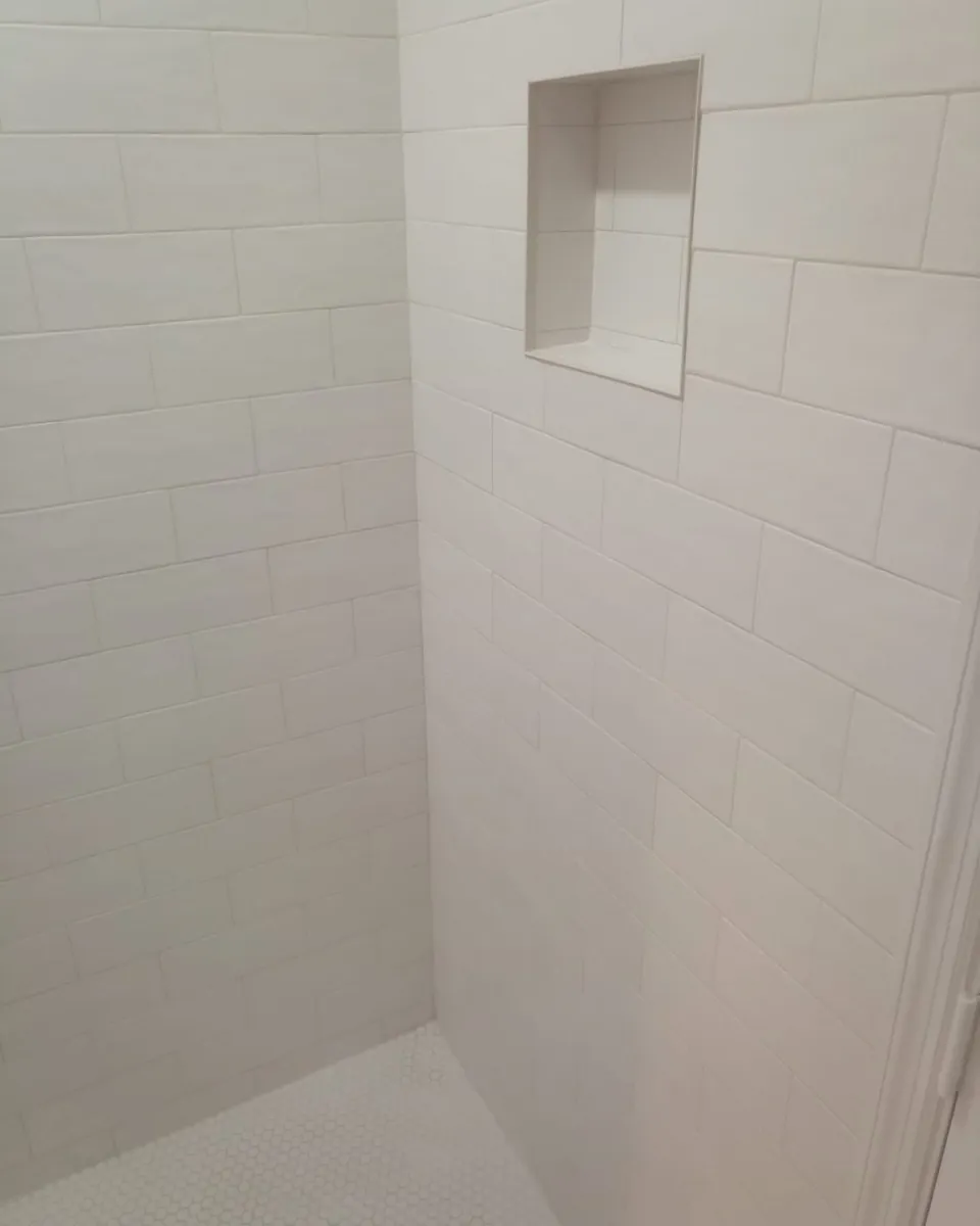 Subway shower walls with hex tile floor