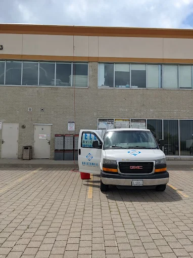 Breathe Well van parked outside a commercial building