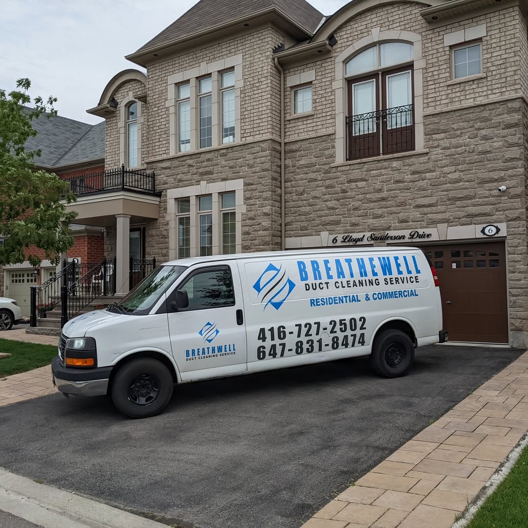 Breathe Well Duct Cleaning van parked outside a customer's home