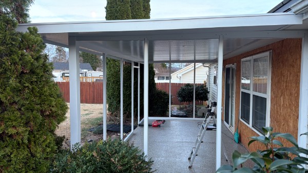 Open covered patio with an aluminum roof system