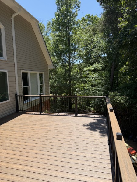 Composite deck with railing by Johansson Builders, LLC