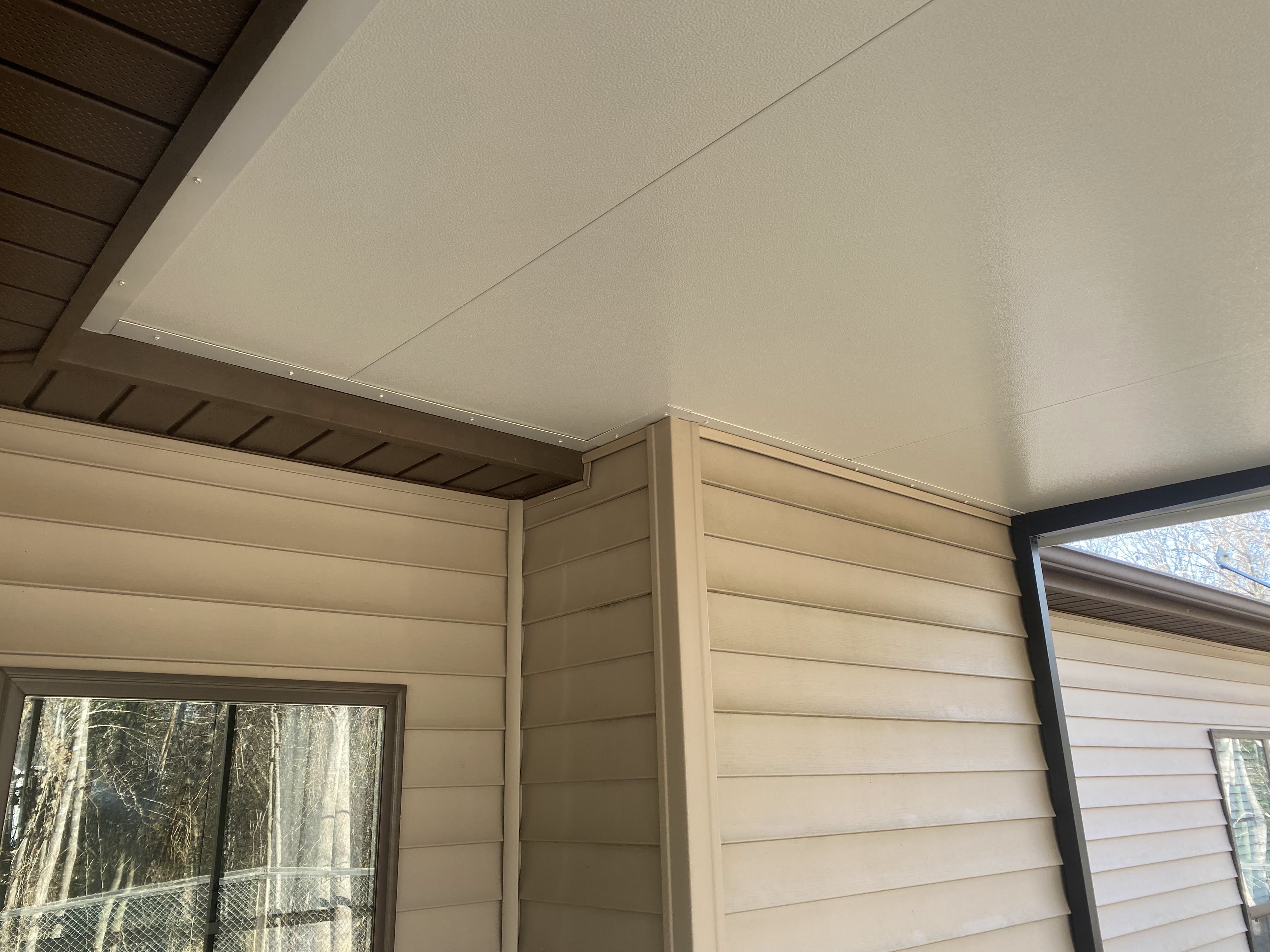 Roof panel and finished integration detail inside the Tirrell porch expansion