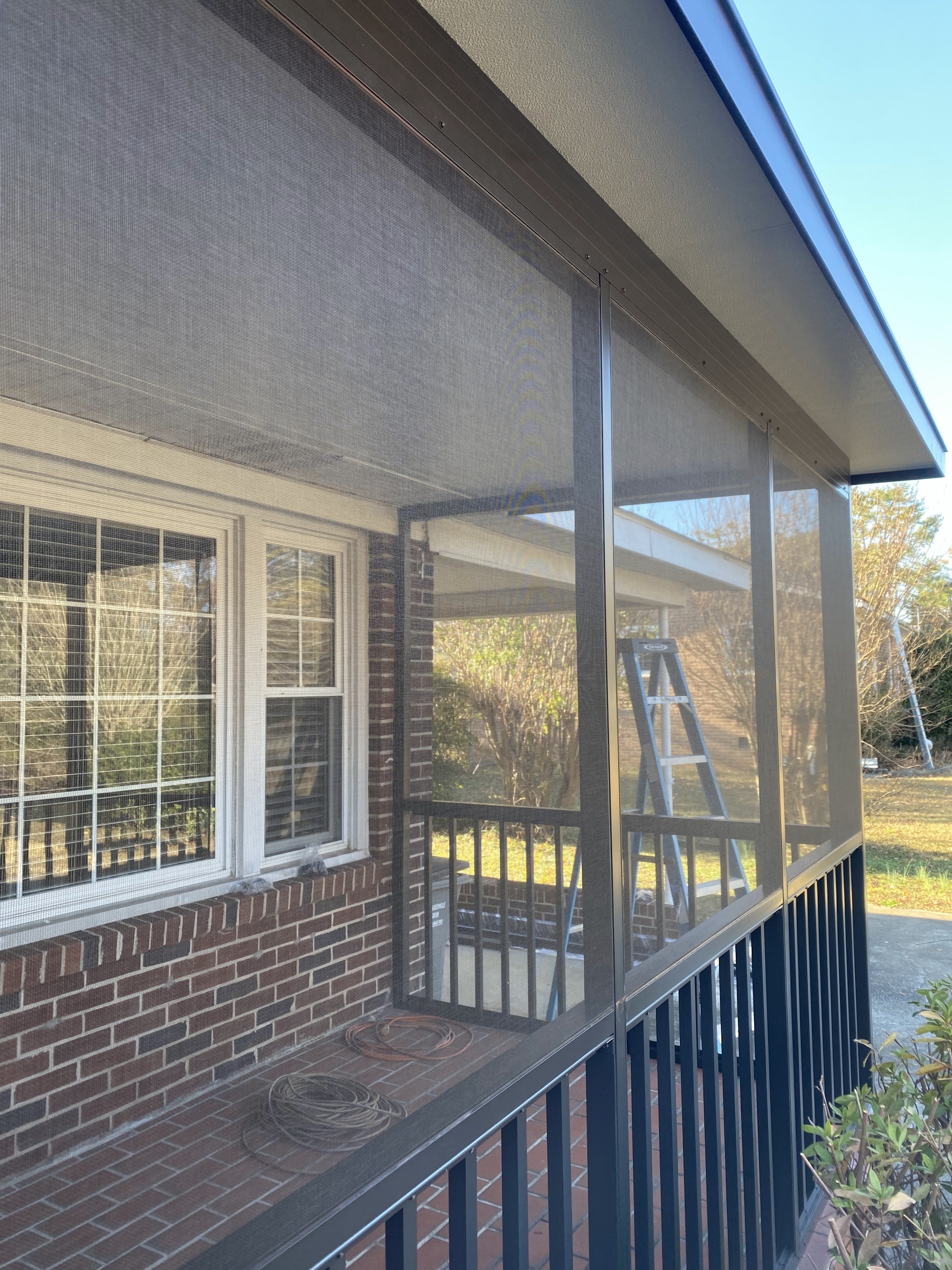 Finished screened side wall and railing on the Rebecca porch in Berea