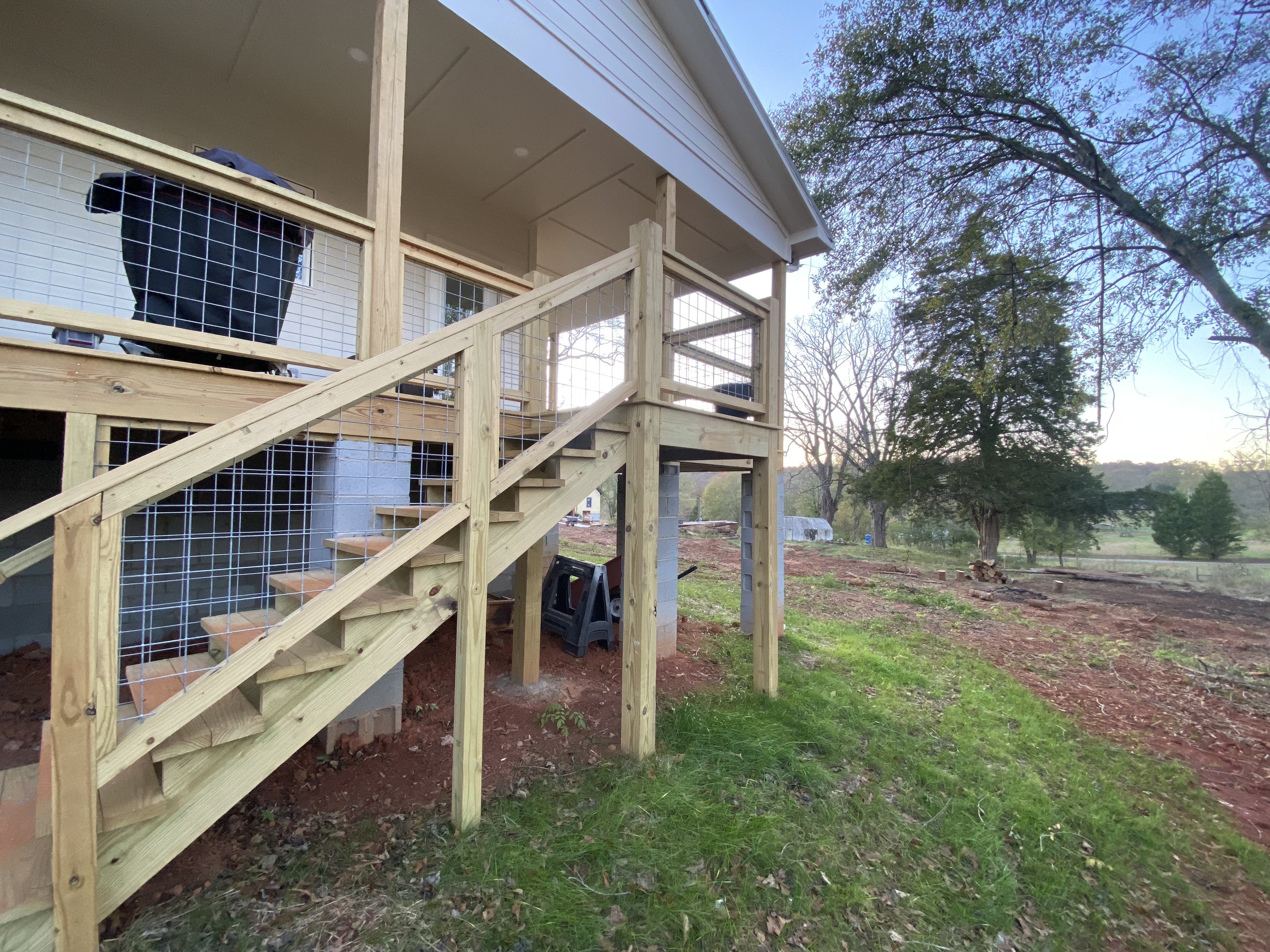 Exterior stair system and open hog-wire railing on the Ryan covered porch