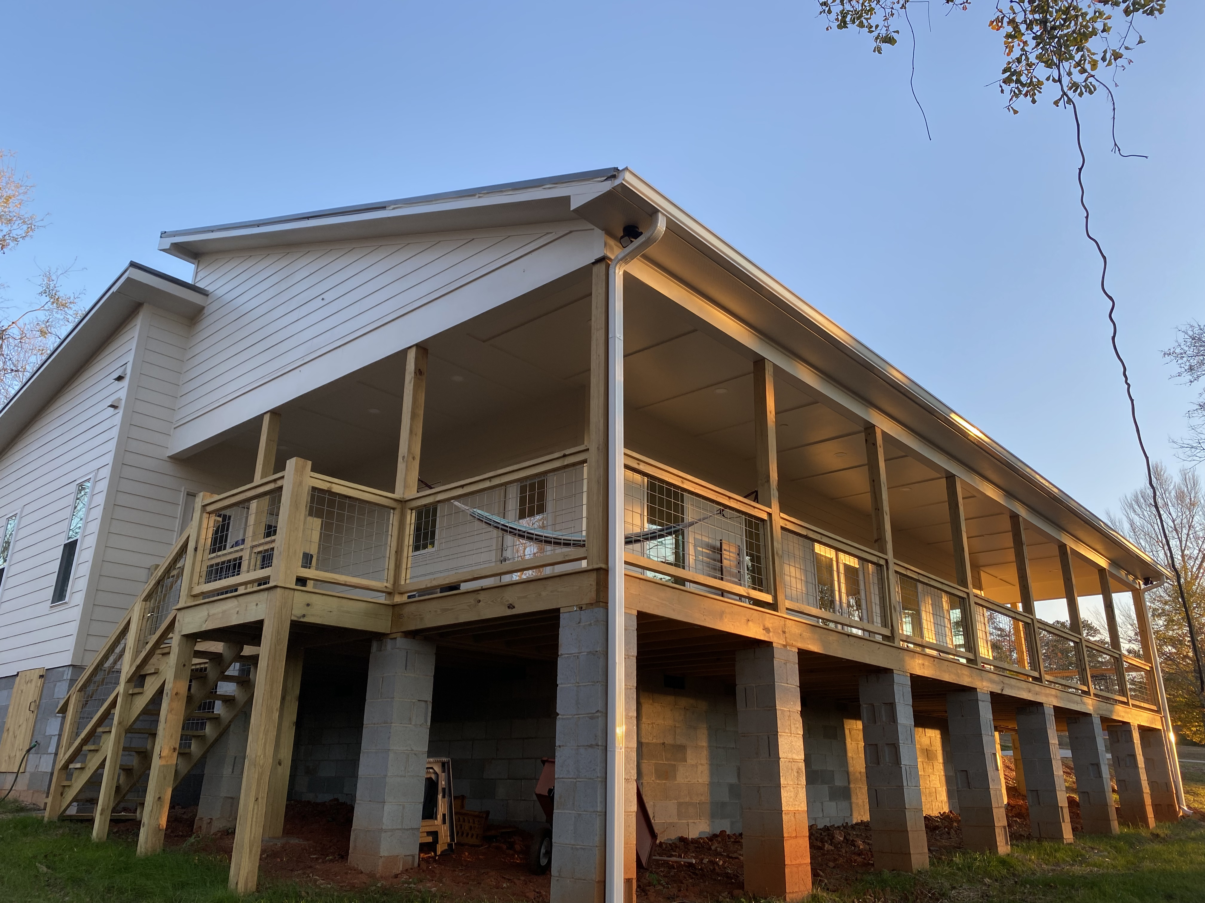 Large elevated covered porch with hog-wire railing near Easley, South Carolina