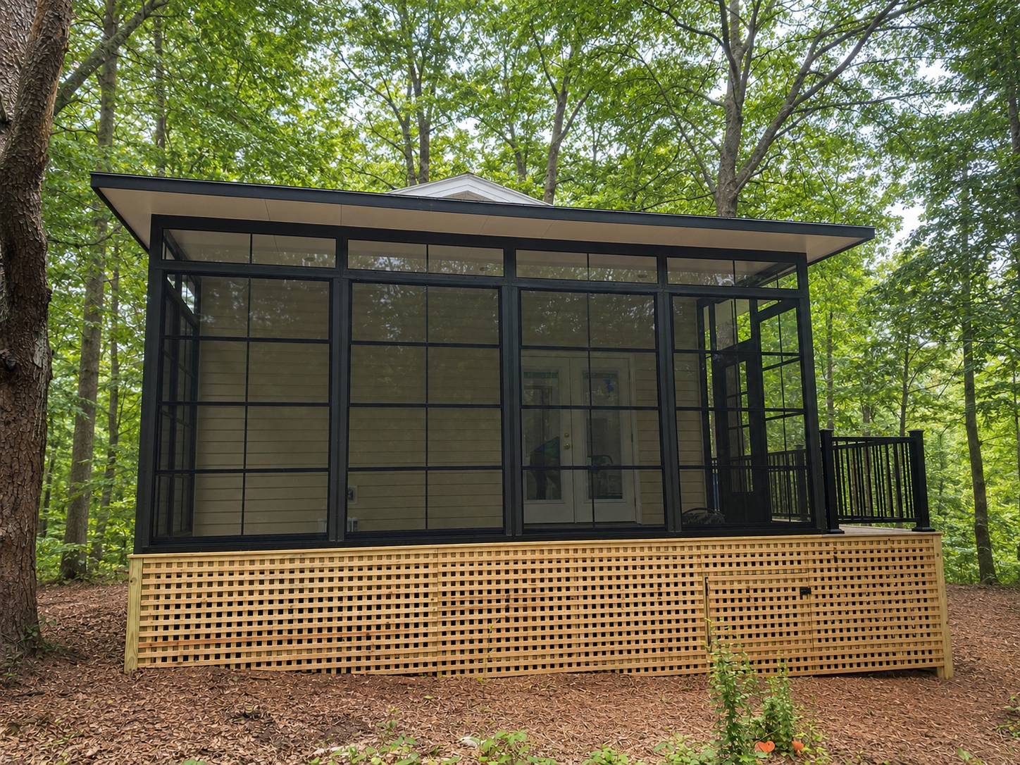 Finished Eze-Breeze porch enclosure attached to a Greenville, South Carolina home