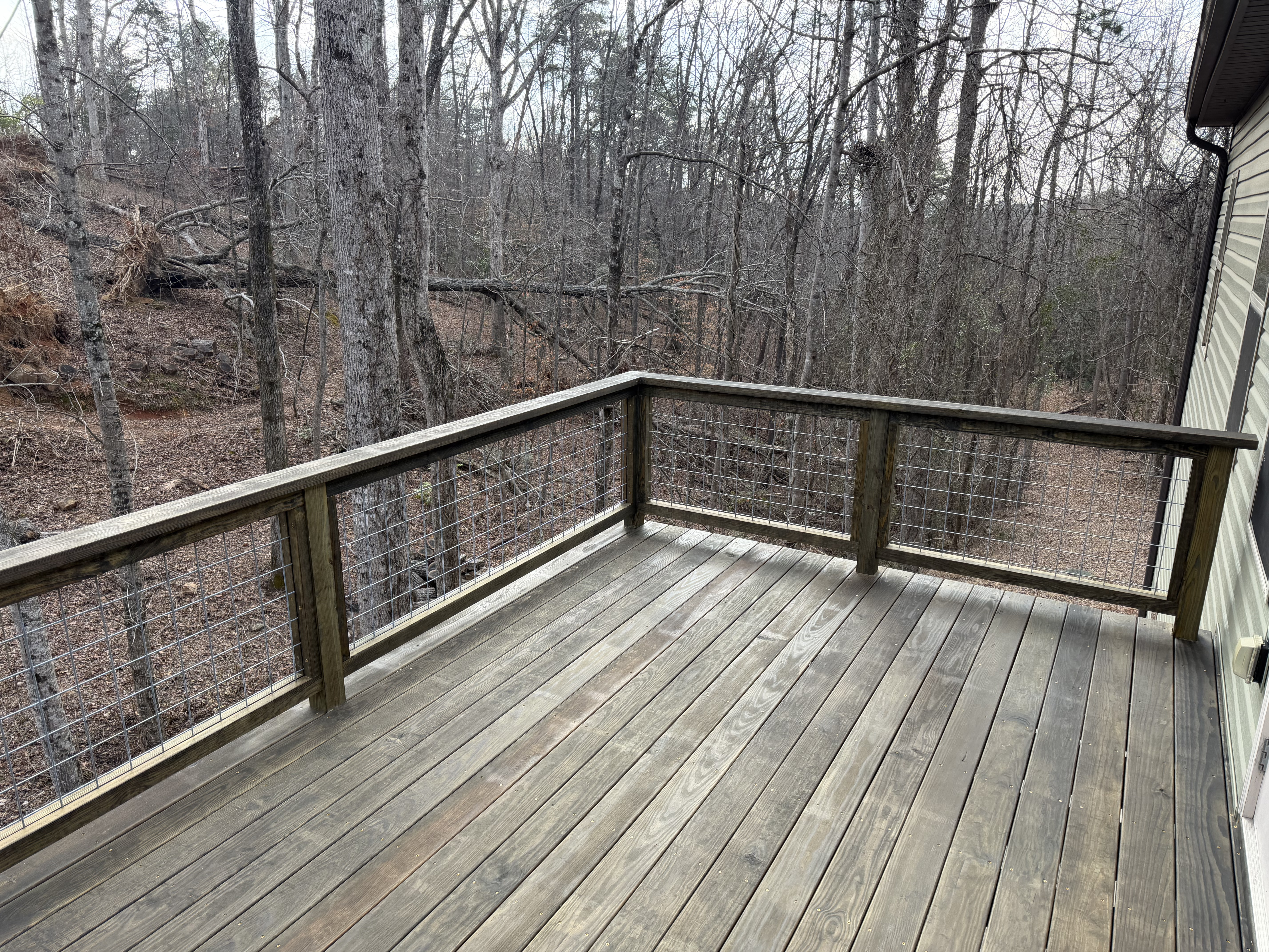 Renovated wood deck with hog-wire railing in Berea, South Carolina