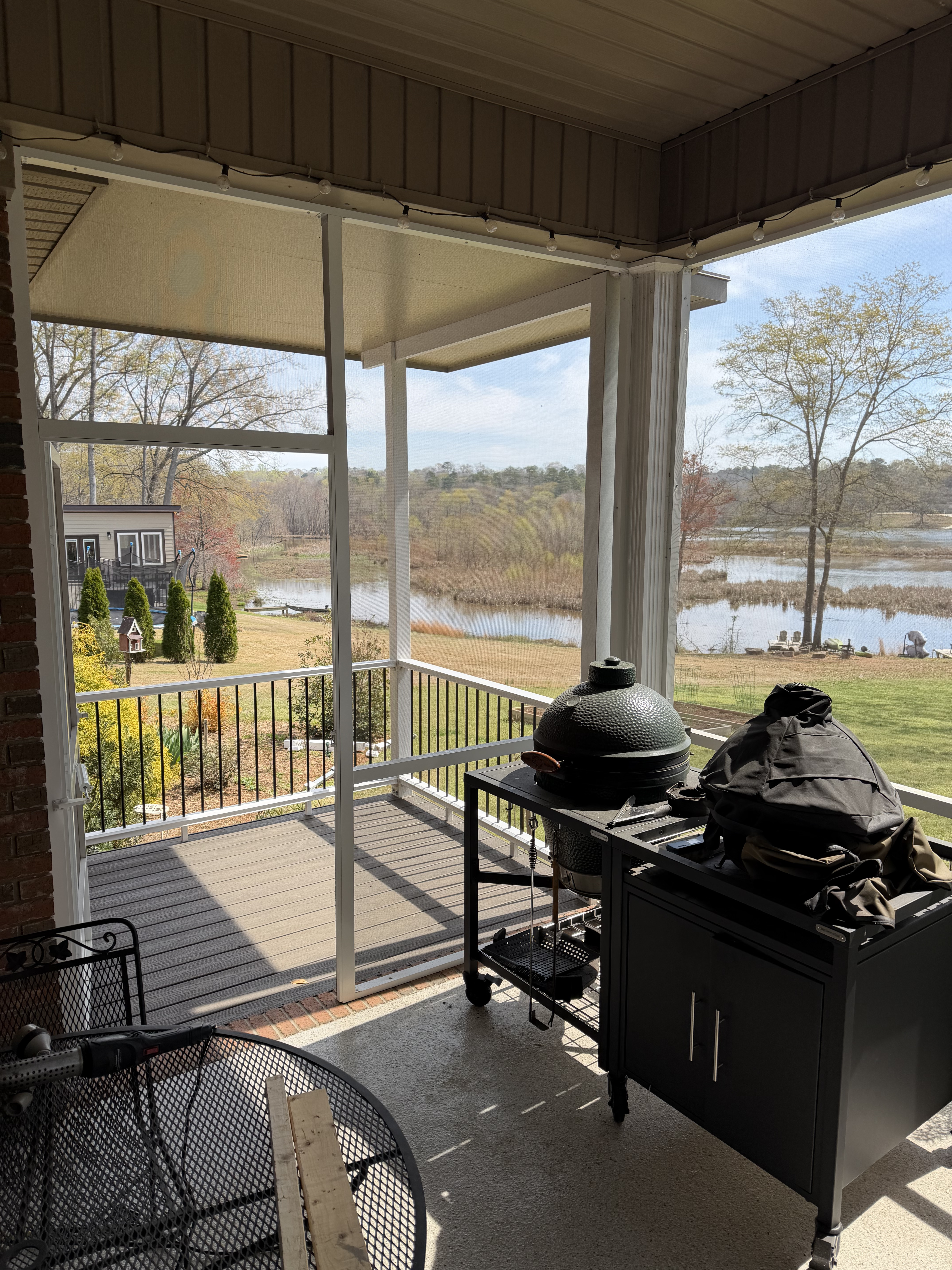 Existing screened porch opening toward the new covered grilling area in Duncan, South Carolina