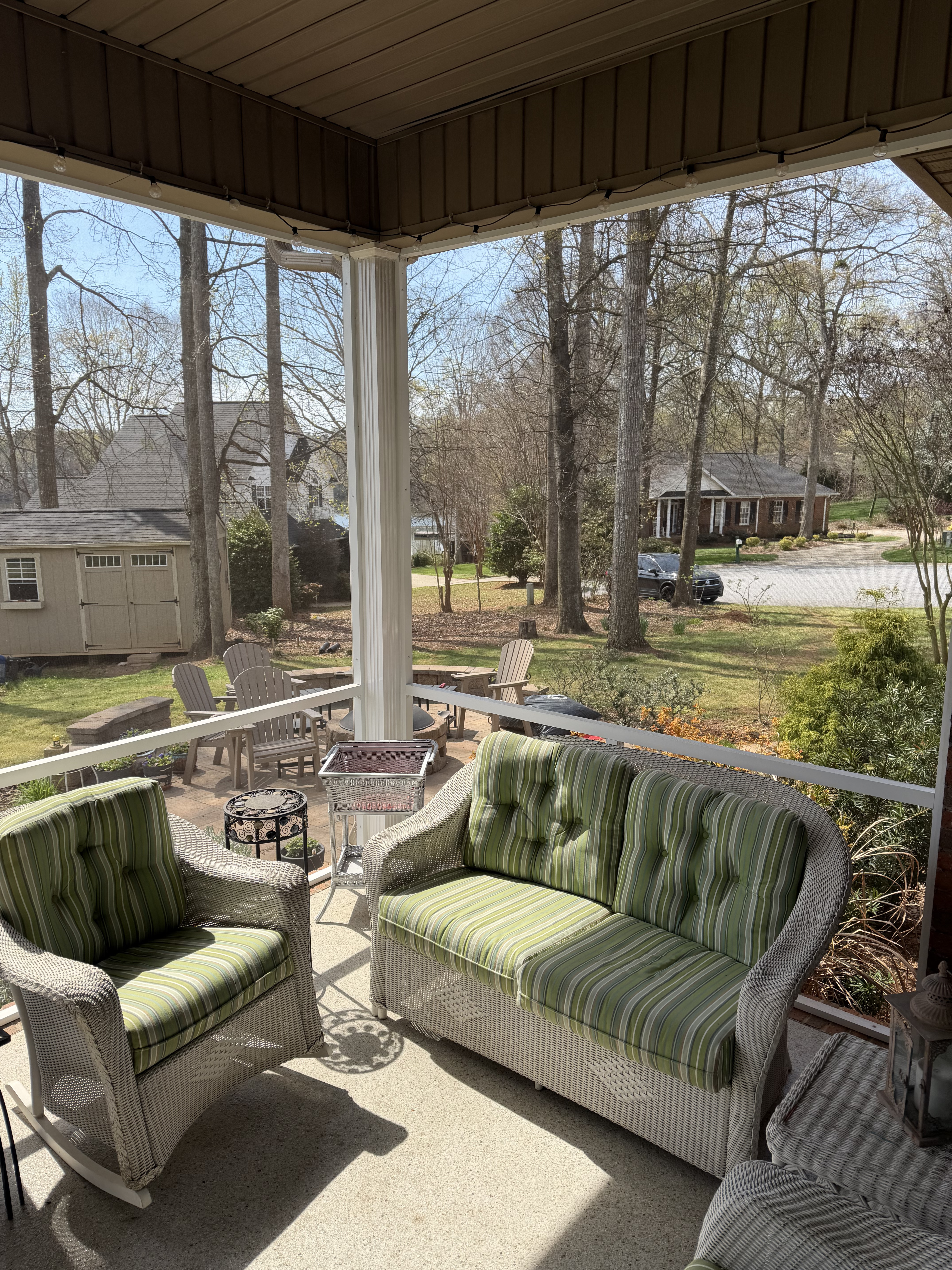 Furnished existing screen porch connected to the expanded outdoor living area in Duncan