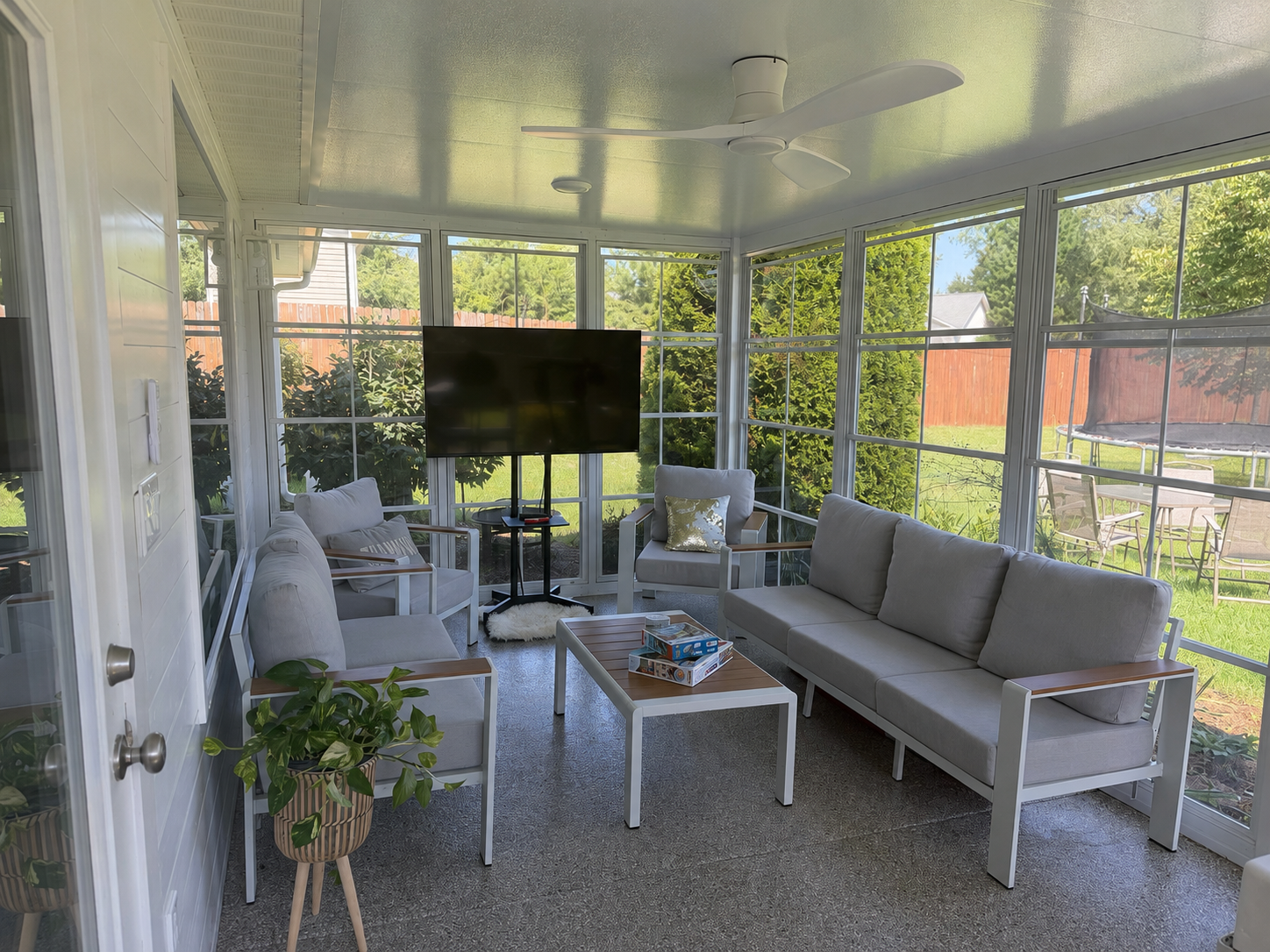 Finished Eze-Breeze outdoor room with dining and seating space in Greenville, South Carolina
