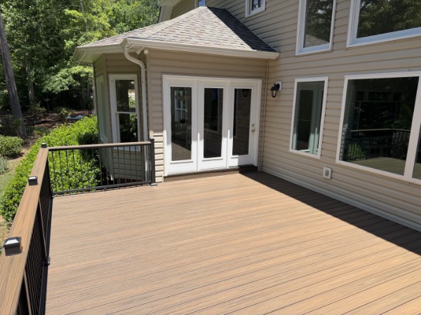 Rebuilt composite deck aligned with the kitchen doors at a Taylors home